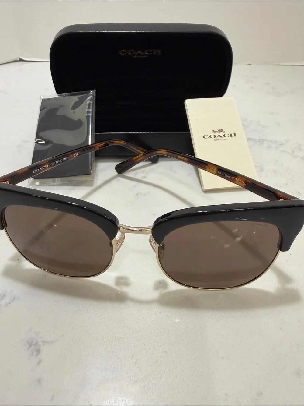 Coach Black Frame Sunglasses with Gold Trim and Brown Lenses
